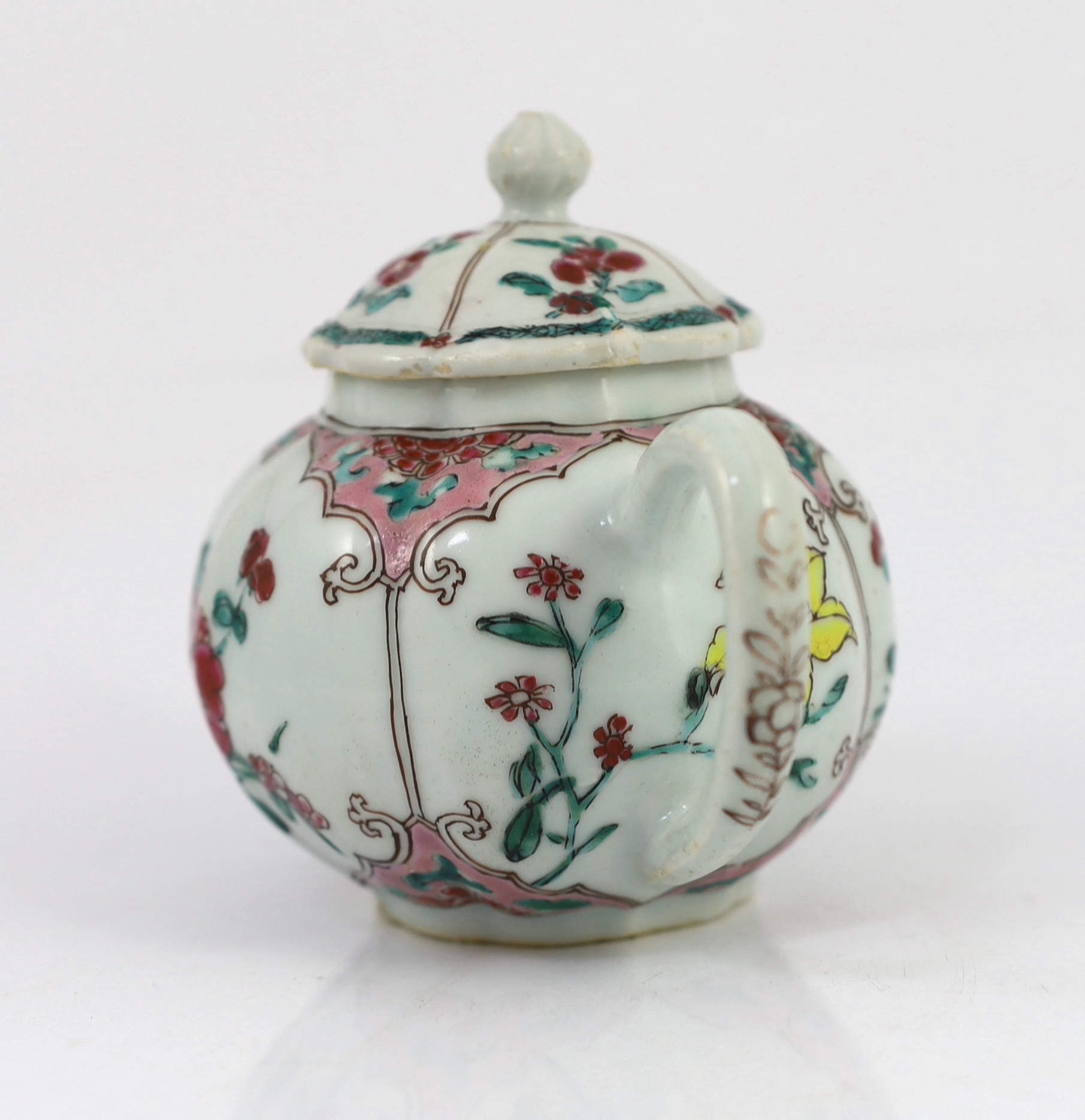 A Chinese famille rose petal lobed teapot, Yongzheng period, minor faults